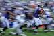 BALTIMORE, MD - NOVEMBER 11: Wide receiver Jacoby Jones #12 of the Baltimore Ravens returns a 105-yard kick-off return for a touchdown against the Oakland Raiders in the fourth quarter at M&T Bank Stadium on November 11, 2012 in Baltimore, Maryland. The Baltimore Ravens won, 55-20. (Photo by Patrick Smith/Getty Images)