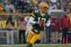 GREEN BAY, WI - NOVEMBER 04: Aaron Rodgers #12 of the Green Bay Packers rolls out to look for a receiver against the Arizona Cardinals at Lambeau Field on November 4, 2012 in Green Bay, Wisconsin. The Packers defeated the Cardinals 31-17. (Photo by Jonathan Daniel/Getty Images)
