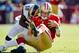 SAN FRANCISCO, CA - NOVEMBER 11: Quarterback Alex Smith #11 of the San Francisco 49ers gets hit by linebacker Jo-Lonn Dunbar #52 of the St. Louis Rams during a run in the first quarter on November 11, 2012 at Candlestick Park in San Francisco, California. (Photo by Brian Bahr/Getty Images)