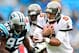 CHARLOTTE, NC - NOVEMBER 18: Charles Johnson #95 of the Carolina Panthers pressures quarterback Josh Freeman #5 of the Tampa Bay Buccaneers as he scrambles out of the pocket during play at Bank of America Stadium on November 18, 2012 in Charlotte, North Carolina. (Photo by Grant Halverson/Getty Images)