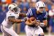INDIANAPOLIS, IN - NOVEMBER 04: Andrew Luck #12 of the Indianapolis Colts escapes the tackle of Cameron Wake #91 of the Miami Dolphins during a fourth quarter play at Lucas Oil Stadium on November 4, 2012 in Indianapolis, Indiana. (Photo by Gregory Shamus/Getty Images)