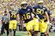 ANN ARBOR, MI - NOVEMBER 26: Denard Robinson #16 of the Michigan Wolverines celebrates a second quarter touchdown with David Molk #50 while playing the Ohio State Buckeyes at Michigan Stadium on November 26, 2011 in Ann Arbor, Michigan. (Photo by Gregory Shamus/Getty Images)