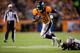 DENVER, CO - OCTOBER 28: Running back Ronnie Hillman #21 of the Denver Broncos is tripped up[ by Cornerback Jabari Greer #33 of the New Orleans Saints at Sports Authority Field Field at Mile High on October 28, 2012 in Denver, Colorado. The Broncos defeated the Saints 34-14. (Photo by Justin Edmonds/Getty Images)