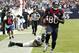 HOUSTON, TX - NOVEMBER 18: Andre Johnson #80 of the Houston Texans scores on a 48 yard reception in overtime against the Jacksonville Jaguars as Dawan Landry #26 of the Jacksonville Jaguars watches at Reliant Stadium on November 18, 2012 in Houston, Texas. Houston won 43-37 in overtime.(Photo by Bob Levey/Getty Images)