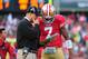 August 20, 2011; San Francisco, CA, USA; San Francisco 49ers head coach Jim Harbaugh (left) talks to quarterback Colin Kaepernick (7) during the third quarter against the Oakland Raiders at Candlestick Park. The 49ers defeated the Raiders 17-3. Mandatory Credit: Kyle Terada-US PRESSWIRE