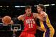 LOS ANGELES, CA - JANUARY 14: Brook Lopez #11 of the New Jersey Nets drives against Pau Gasol #16 of the Los Angeles Lakers at Staples Center on January 14, 2011 in Los Angeles, California. The Lakers won 100-88. NOTE TO USER: User expressly acknowledges and agrees that, by downloading and or using this photograph, User is consenting to the terms and conditions of the Getty Images License Agreement. (Photo by Stephen Dunn/Getty Images)