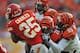 KANSAS CITY, MO - NOVEMBER 18: Defenders Taylor Mays #26 and Wallace Gilberry #95 of the Cincinnati Bengals tackle running back Jamaal Charles #25 of the Kansas City Chiefs during the second half on November 18, 2012 at Arrowhead Stadium in Kansas City, Missouri. Cincinnati defeated Kansas City 28-6. (Photo by Peter Aiken/Getty Images)