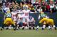 GREEN BAY, WI - JANUARY 15: Eli Manning #10 of the New York Giants in action behind the line of scrimage against the Green Bay Packers during their NFC Divisional playoff game at Lambeau Field on January 15, 2012 in Green Bay, Wisconsin. (Photo by Jamie Squire/Getty Images)