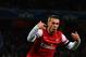 Lukas Podolski celebrates his second half goal against Montpellier