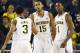 November 12, 2012; Ann Arbor, MI, USA; Michigan Wolverines forward Jon Horford (15) receives congratulations from guard Trey Burke (3) and forward Glenn Robinson III (1) after scoring a basket against the IUPUI Jaguars in the second half of a preseason NIT game at Crisler Center. Mandatory Credit: Rick Osentoski-US PRESSWIRE