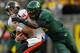 EUGENE, OR - NOVEMBER 26: Dion Jordan #96 of the Oregon Ducks tries to sackes quarterback Sean Mannion #4 of the Oregon State Beavers during the 115th Civil War on November 26, 2011 at the Autzen Stadium in Eugene, Oregon. (Photo by Jonathan Ferrey/Getty Images)