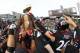 CINCINNATI, OH - DECEMBER 03: Drew Frey #26 of the Cincinnati Bearcats reaches for the Big East Championship trophy while celebrating with teammates after the Bearcats defeated the Connecticut Huskies 35-27 to claim their share of the 2011 Big East Championship on December 3, 2011 at Nippert Stadium in Cincinnati, Ohio. (Photo by Tyler Barrick/Getty Images)