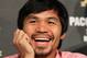 BEVERLY HILLS, CA - SEPTEMBER 17: Boxer Manny Pacquiao laughs during the Manny Pacquiao v Juan Manuel Marquez - Press Conference at Beverly Hills Hotel on September 17, 2012 in Beverly Hills, California. (Photo by Victor Decolongon/Getty Images)