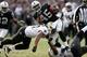 OAKLAND, CA - NOVEMBER 18: Marcel Reece #45 of the Oakland Raiders is hit by David Hawthorne #57 of the New Orleans Saints at O.co Coliseum on November 18, 2012 in Oakland, California. (Photo by Ezra Shaw/Getty Images)