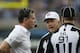 Referee Walt Coleman informs Lions coach Jim Schwartz his replay request has violated NFL Rules.
