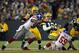 GREEN BAY, WI - JANUARY 15: Aaron Rodgers #12 of the Green Bay Packers gets sacked by Jason Pierre-Paul #90 and Michael Boley #59 of the New York Giants during their NFC Divisional playoff game at Lambeau Field on January 15, 2012 in Green Bay, Wisconsin. (Photo by Jamie Squire/Getty Images)