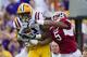 BATON ROUGE, LA - NOVEMBER 25: Rueben Randle #2 of the LSU Tigers catches a pass over Tramain Thomas #5 of the Arkansas Razorbacks at Tiger Stadium on November 25, 2011 in Baton Rouge, Louisiana. The Tigers defeated the Razorbacks 41 to 17. (Photo by Wesley Hitt/Getty Images)
