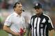 DETROIT, MI - NOVEMBER 22: Detroit Lions head coach Jim Schwartz (L) talks with NFL official Jerry Bergman during a disputed play during the game against the Houston Texans at Ford Field on November 22, 2012 in Detroit, Michigan. The Texans defeated the Lions 34-31. (Photo by Leon Halip/Getty Images)