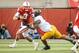 LINCOLN, NE - NOVEMBER 17: Quarterback Taylor Martinez #3 of the Nebraska Cornhuskers tries to slip past linebacker Aaron Hill #57 of the Minnesota Golden Gophers during their game at Memorial Stadium on November 17, 2012 in Lincoln, Nebraska. Nebraska won 38-14. (Photo by Eric Francis/Getty Images)