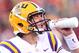 Nov 23, 2012; Fayetteville, AR, USA; LSU Tigers quarterback Zach Mettenberger (8) during a timeout in the game against the Arkansas Razorbacks at Donald W. Reynolds Razorback Stadium. LSU defeated Arkansas 20-13. Mandatory Credit: Nelson Chenault-US PRESSWIRE