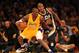 LOS ANGELES, CA - DECEMBER 27: Kobe Bryant #24 of the Los Angeles Lakers controls the ball against Raja Bell #19 of the Utah Jazz at Staples Center on December 27, 2011 in Los Angeles, California. NOTE TO USER: User expressly acknowledges and agrees that, by downloading and or using this photograph, User is consenting to the terms and conditions of the Getty Images License Agreement. (Photo by Stephen Dunn/Getty Images)