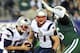 EAST RUTHERFORD, NJ - NOVEMBER 22: Tom Brady #12 of the New England Patriots braces as he is sacked by Muhammad Wilkerson #96 of the New York Jets on November 22, 2012 at MetLife Stadium in East Rutherford, New Jersey. (Photo by Elsa/Getty Images)