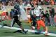 Nov 24, 2012; Durham, NC, USA; Miami Hurricanes running back Duke Johnson (8) runs past Duke Blue Devils safety Walt Canty (4) for a touchdown during the first half at Wallace Wade Stadium. Mandatory Credit: Mark Dolejs-US PRESSWIRE