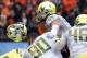 CORVALLIS, OR - NOVEMBER 24: Defensive tackle Ricky Heimuli #90 of the Oregon Ducks has his helmet pop off as he makes a tackle in the second quarter of the game against the Oregon State Beavers on November 24, 2012 at Reser Stadium in Corvallis, Oregon. (Photo by Steve Dykes/Getty Images)