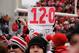 COLUMBUS, OH - NOVEMBER 24: Ohio State Buckeyes fans storm the field and hold a sign showing Ohio State's season record after the Buckeyes defeated the Michigan Wolverines 26-21at Ohio Stadium on November 24, 2012 in Columbus, Ohio. Despite a perfect record Ohio State is not eligible to play in a bowl game. (Photo by Jamie Sabau/Getty Images)