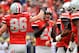 COLUMBUS, OH - NOVEMBER 24: Placekicker Drew Basil #24 of the Ohio State Buckeyes is congratulated by teammate Jeff Heuerman #86 after kicking a 28-yard field goal in the second half against the Michigan Wolverines at Ohio Stadium on November 24, 2012 in Columbus, Ohio. Basil had four field goals in Ohio State's 26-21 win over Michigan. (Photo by Jamie Sabau/Getty Images)