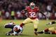 SAN FRANCISCO, CA - NOVEMBER 19: Kendall Hunter #32 of the San Francisco 49ers breaks the tackle of Brian Urlacher #54 of the Chicago Bears for a six yard gain during the game at Candlestick Park on November 19, 2012 in San Francisco, California. (Photo by Thearon W. Henderson/Getty Images)