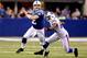 INDIANAPOLIS, IN - NOVEMBER 25: Quarterback Andrew Luck #12 of the Indianapolis Colts looks for an open receiver while being chased out of the pocket by Kyle Moore #54 of the Buffalo Bills at Lucas Oil Stadium on November 25, 2012 in Indianapolis, Indiana. (Photo by Matthew Stockman/Getty Images)