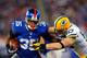 EAST RUTHERFORD, NJ - NOVEMBER 25: Running back Andre Brown #35 of the New York Giants runs with the ball against inside linebacker A.J. Hawk #50 of the Green Bay Packers at MetLife Stadium on November 25, 2012 in East Rutherford, New Jersey. (Photo by Rich Schultz/Getty Images)