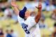 LOS ANGELES, CA - AUGUST 20: WWE Superstar John Cena throws the ceremonial first pitch for the Los Angeles Dodgers as they play the Chicago Cubs on August 20, 2009 at Dodger Stadium in Los Angeles, California. (Photo by Jacob de Golish/Getty Images)