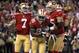 November 19, 2012; San Francisco, CA, USA; San Francisco 49ers tight end Vernon Davis (85) is congratulated by quarterback Colin Kaepernick (7) and guard Alex Boone (75) after catching a touchdown pass against the Chicago Bears in the first quarter at Candlestick Park. Mandatory Credit: Cary Edmondson-US PRESSWIRE