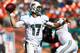 MIAMI GARDENS, FL - NOVEMBER 25: Quarterback Ryan Tannehill #17 of the Miami Dolphins throws against the Seattle Seahawks at Sun Life Stadium on November 25, 2012 in Miami Gardens, Florida. (Photo by Marc Serota/Getty Images)
