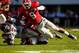 Nov 3, 2012; Athens, GA, USA; Mississippi Rebels quarterback Randall Mackey (1) is tackled by Georgia Bulldogs linebacker Alec Ogletree (9) in the first half at Sanford Stadium. Mandatory Credit: Daniel Shirey-US PRESSWIRE
