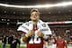 TUSCALOOSA, AL - NOVEMBER 24: AJ McCarron #10 of the Alabama Crimson Tide runs onto the field after their 49-0 win over the Auburn Tigers at Bryant-Denny Stadium on November 24, 2012 in Tuscaloosa, Alabama. (Photo by Kevin C. Cox/Getty Images)