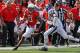September 15, 2012; College Park, MD, USA; Connecticut Huskies safety Andrew Adams (22) prepares to tackle Maryland Terrapins wide receiver Kerry Boykins (13) at Byrd Stadium. Mandatory Credit: Mitch Stringer-US PRESSWIRE