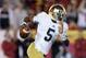 LOS ANGELES, CA - NOVEMBER 24: Quarterback Everett Golson #5 of the Notre Dame Fighting Irish carries the ball against the USC Trojans at Los Angeles Memorial Coliseum on November 24, 2012 in Los Angeles, California. (Photo by Jeff Gross/Getty Images)