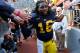 ANN ARBOR, MI - NOVEMBER 17: Denard Robinson #16 of the Michigan Wolverines leaves the field after a 42-17 win over the Iowa Hawkeyes at Michigan Stadium on November 17, 2012 in Ann Arbor, Michigan. (Photo by Gregory Shamus/Getty Images)