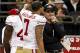 November 25, 2012; New Orleans, LA, USA; San Francisco 49ers head coach Jim Harbaugh talks with quarterback Colin Kaepernick (7) after he threw an interception during the second quarter of a game against the New Orleans Saints at the Mercedes-Benz Superdome. Mandatory Credit: Derick E. Hingle-US PRESSWIRE