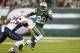 EAST RUTHERFORD, NJ - NOVEMBER 22: Running back Bilal Powell #29 of the New York Jets attempts to get past Patrick Chung #25 of the New England Patriots in a game at MetLife Stadium on November 22, 2012 in East Rutherford, New Jersey. The Patriots defeated the Jets 49-19. (Photo by Rich Schultz /Getty Images)