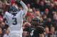 Dec 3, 2011; Cincinnati, OH, USA; Cincinnati Bearcats quarterback Munchie Legaux (4) throws the ball past Connecticut Huskies linebacker Sio Moore during the first half at Nippert Stadium Mandatory Credit: Tony Tribble-US PRESSWIRE