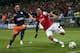MONTPELLIER, FRANCE - SEPTEMBER 18: Remy Cabella of Montpellier tries to block Kieran Gibbs of Arsenal during the UEFA Champions League match between Montpellier Herault SC and Arsenal at Stade de la Mosson on September 18, 2012 in Montpellier, France. (Photo by Julian Finney/Getty Images)
