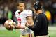 NEW ORLEANS, LA - NOVEMBER 25: Colin Kaepernick #7 of the San Francisco 49ers speaks with head coach Jim Harbaugh during a game against the New Orleans Saints at the Mercedes-Benz Superdome on November 25, 2012 in New Orleans, Louisiana. (Photo by Stacy Revere/Getty Images)