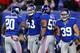 EAST RUTHERFORD, NJ - NOVEMBER 25: Cornerback Prince Amukamara #20, middle linebacker Chase Blackburn #93, outside linebacker Michael Boley #59 and defensive back Tyler Sash #39 of the New York Giants reacts after a play against the Green Bay Packers at MetLife Stadium on November 25, 2012 in East Rutherford, New Jersey. (Photo by Al Bello/Getty Images)