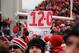 COLUMBUS, OH - NOVEMBER 24: Ohio State Buckeyes fans storm the field and hold a sign showing Ohio State's season record after the Buckeyes defeated the Michigan Wolverines 26-21at Ohio Stadium on November 24, 2012 in Columbus, Ohio. Despite a perfect record Ohio State is not eligible to play in a bowl game. (Photo by Jamie Sabau/Getty Images)