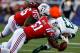 FOXBORO, MA - OCTOBER 21: Brandon Spikes #55 and Jerod Mayo #51 of the New England Patriots force a fumble on Shonn Greene #23 of the New York Jets during the game on October 21, 2012 at Gillette Stadium in Foxboro, Massachusetts. (Photo by Jared Wickerham/Getty Images)