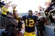 ANN ARBOR, MI - NOVEMBER 17: Devin Gardner #12 of the Michigan Wolverines leaves the field high giving fans after a 42-17 victory over the Iowa Hawkeyes at Michigan Stadium on November 17, 2012 in Ann Arbor, Michigan. (Photo by Gregory Shamus/Getty Images)